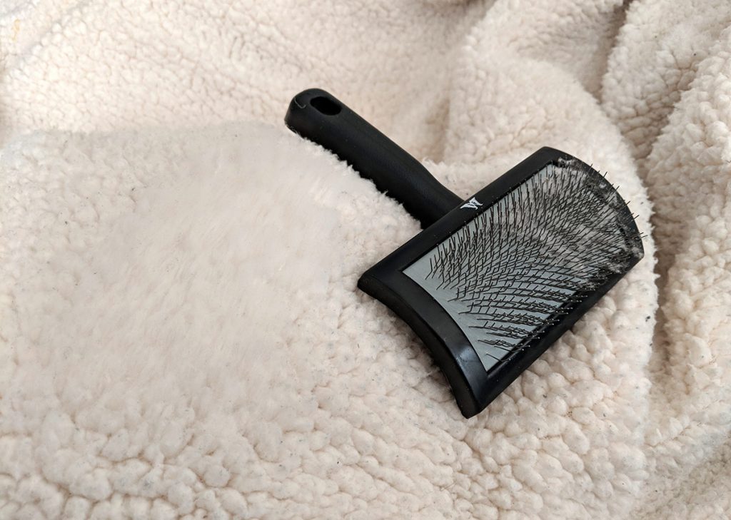 combing with the right brush breaks up clumps, removes dirt, and restores a plush texture
